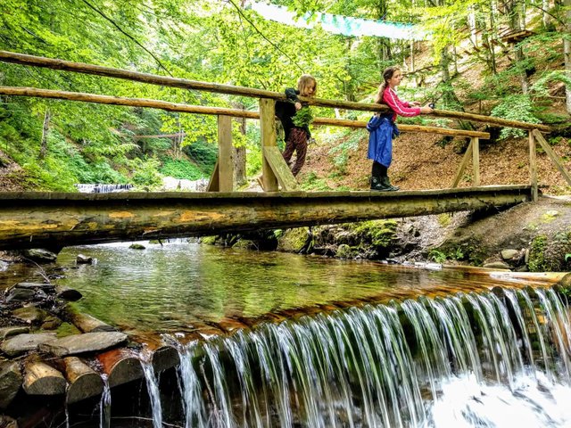 Wooden bridge over a mountain river