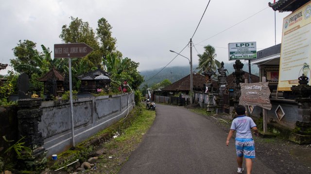 The sign says Waterfall Juwuk Manis to the right.