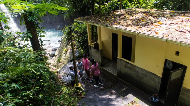 Getting the entrance ticket to the waterfall.