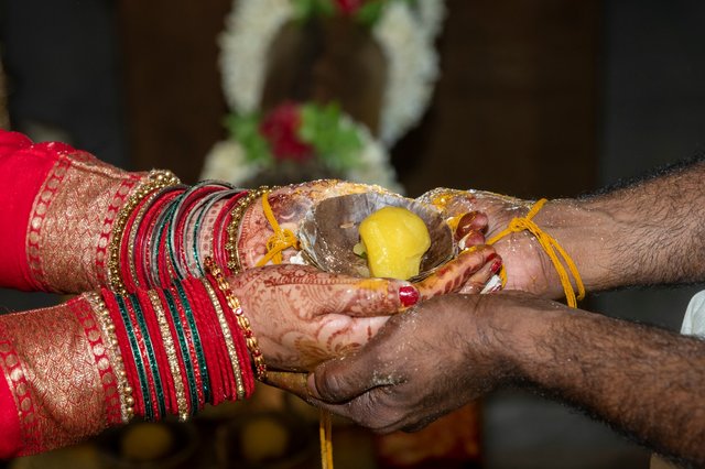 You can see the thread tied to two specific points on our ring fingers.