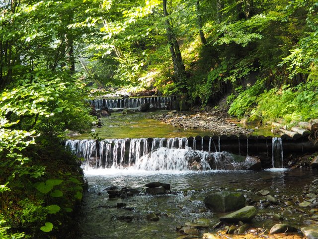 Small artificial waterfalls on the river