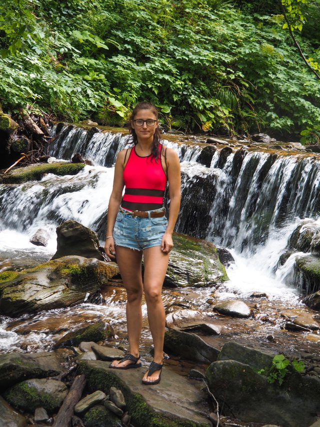 My friend on the background of a mountain river