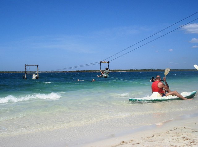 Landing on the beach from the zip line