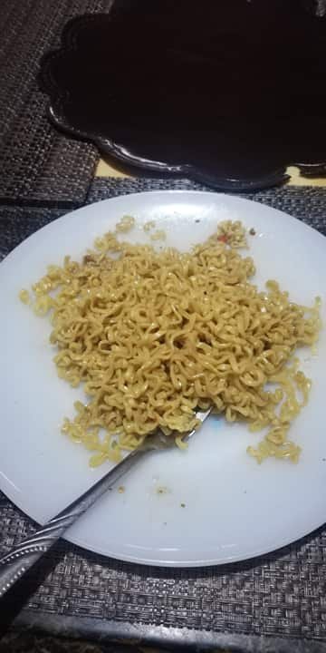 Eating my pancit canton snack at home