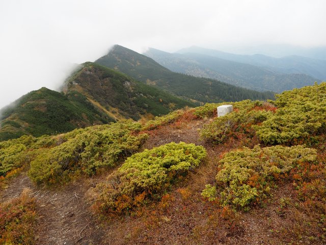 Three peaks in the fog