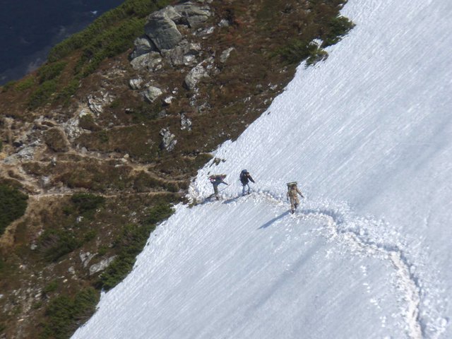 Path on the snow-covered slope of the mountain