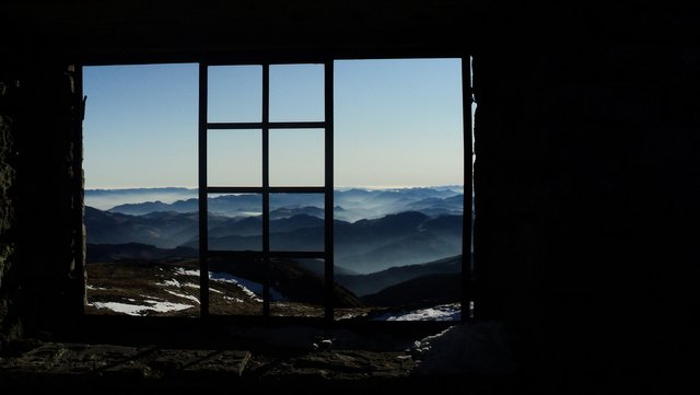 A window in a dilapidated observatory