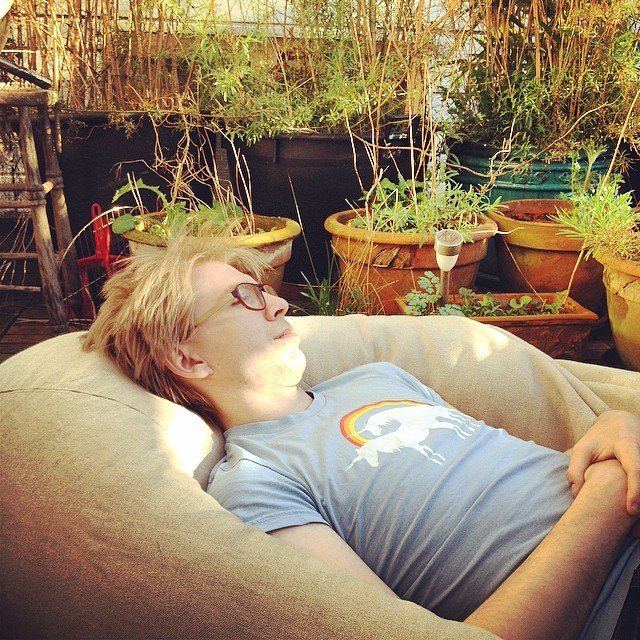 Daniel relaxing in the sunshine in Amsterdam