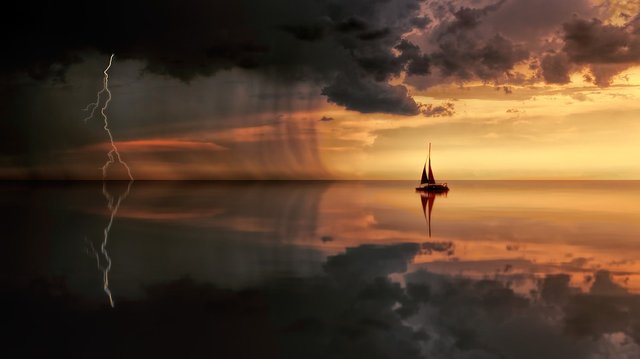 Sunset, storm and boat