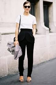 ways to style a white shirt .White shirt tucked into a tummy pant and a flat sandal