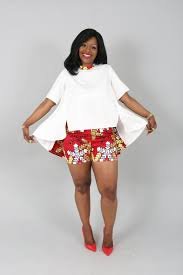 ways to style a white shirt .White shirt on short African print shorts and heels