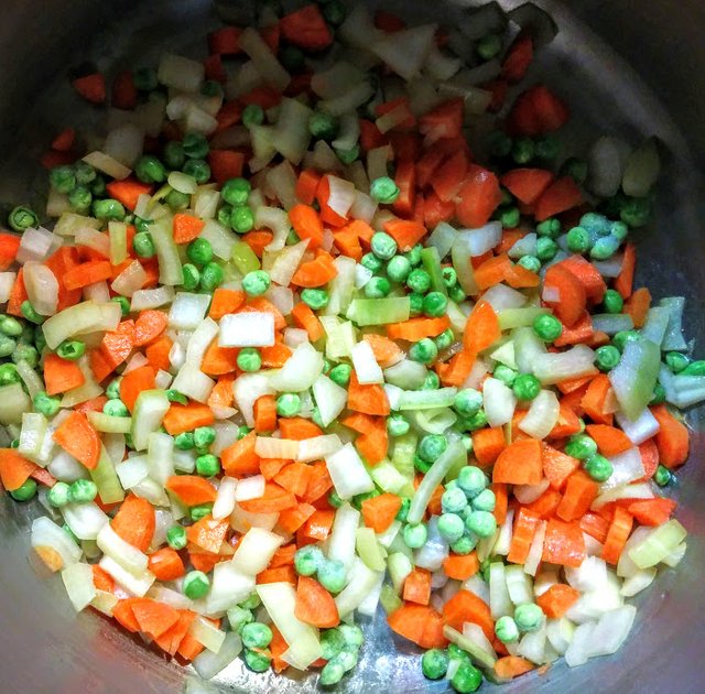 Onions, carrots and peas, soon to be followed by potatoes in Oleg’s soup!