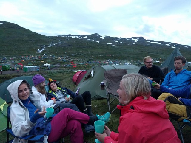 Picture of friends and the festival in the background