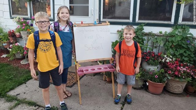 Molly Schmitz said her three children Jack, Lily and Jase are recyling and reusing many of their school supplies, including backpacks, this year.
