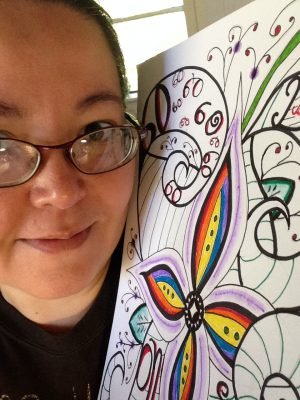 Meredith Loughran posing with her original art 60 Days on Steemit