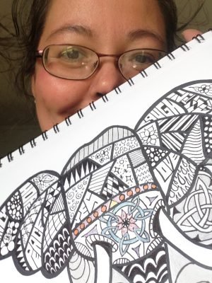 Meredith Loughran posing with the final doodle art Elephant
