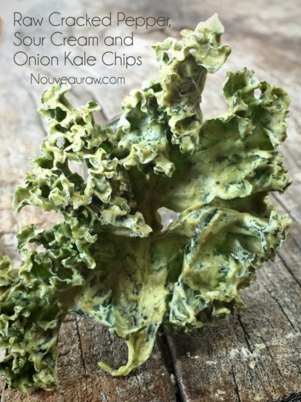 a close up raw vegan Cracked Pepper, Sour Cream and Onion Kale Chips
