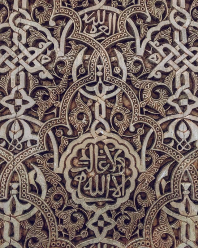 Stunning detail of the Arabic calligraphy that covers nearly every square foot of the interior palace walls.