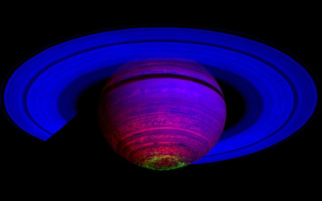 Saturn with aurora and colorized purpleish
