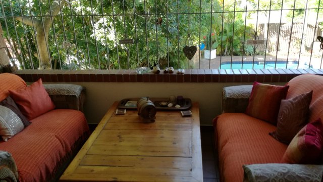 Enclosed balcony overlooking pool