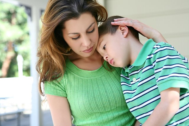 bigstock-Tired-Boy-At-Home-With-Mother-6566172.jpg