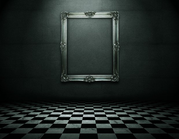 ornate-silver-frame-in-dark-room.jpg