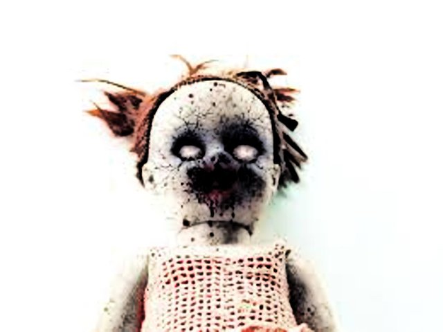 scary doll burnt face.jpg