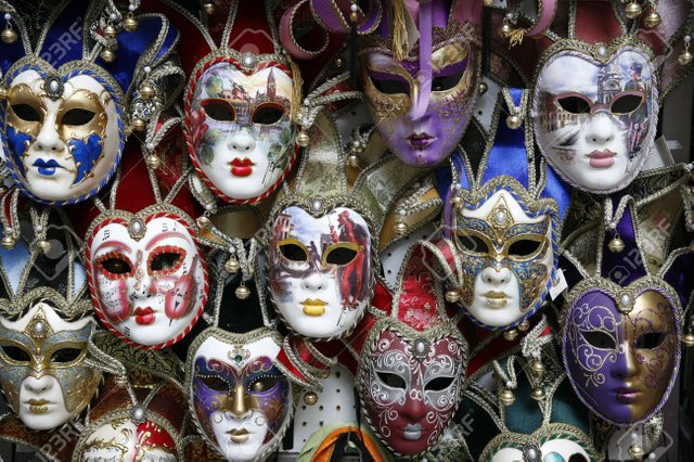 1843223-beautiful-carnival-masks-venice-italy-displayed-on-black-.jpg