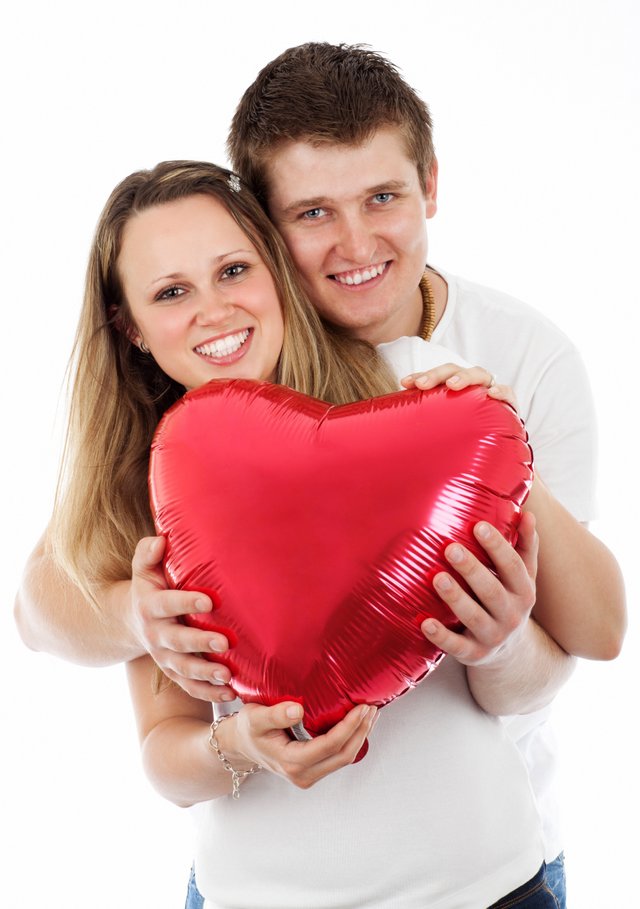 couple-holding-heart-balloon-on-valentines-day.jpg