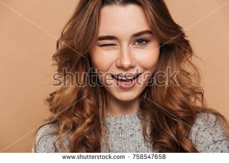 stock-photo-close-up-photo-of-young-charming-brunette-woman-blinks-one-eye-and-looking-at-camera-isolated-over-758547658.jpg