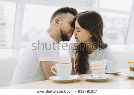 stock-photo-attractive-happy-young-couple-on-a-date-in-a-cafe-having-some-tasty-coffee-or-chocolate-handsome-639491017.jpg