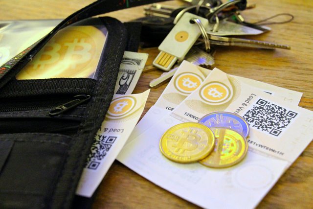 bitcoin-paper-coin-and-USB-wallets.jpg