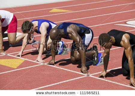 stock-photo-male-athletes-at-starting-line-in-track-race-111565211.jpg