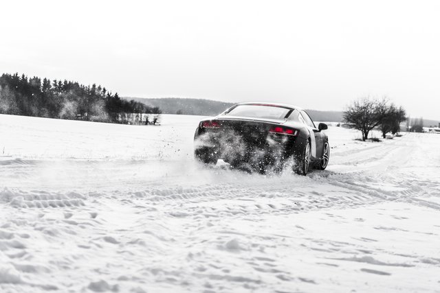 supercar-drifting-on-a-snow-covered-road-picjumbo-com.jpg