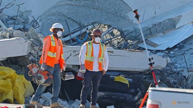 workers-remove-debris-from-a-collapsed-pedestrian-bridge-at-florida-international-university-in-miami-3.jpg