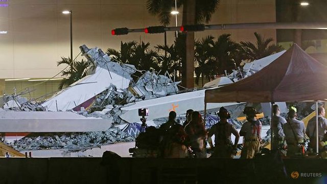 first-responders-are-shown-as-rescue-efforts-continue-after-a-pedestrian-bridge-collapsed-at-florida-international-university-in-miami--florida-5.jpg