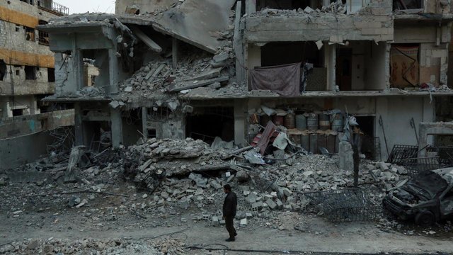 032317500_1519720972-20180225-Kondisi-Bangunan-di-Kota-Douma-Ghouta-Timur-Suriah-AFP-6.jpg