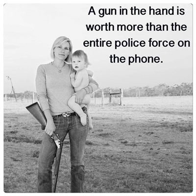 Woman_with_gun_and_baby_on_farm
