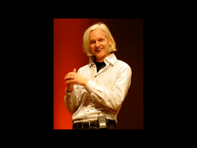 Assange Man On-Stage.png