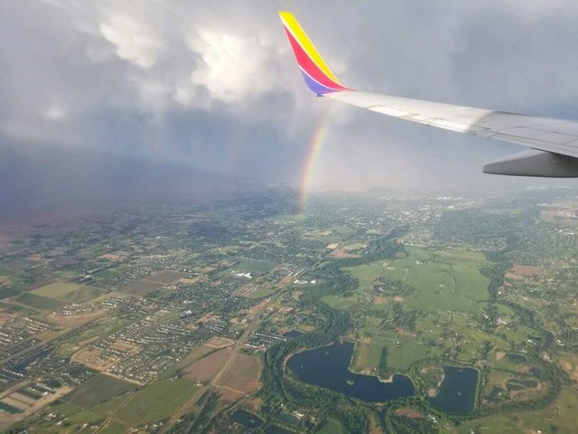 https://s3.us-east-2.amazonaws.com/partiko.io/img/marijuanaguide-rainbow-from-a-plane-1527732162271.png