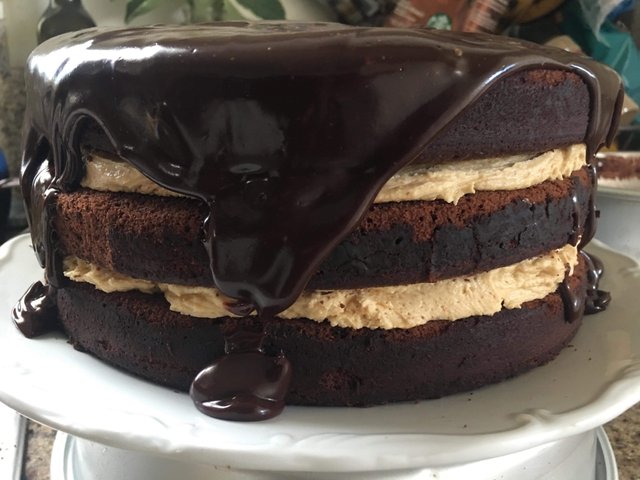 https://s3.us-east-2.amazonaws.com/partiko.io/img/runridefly-homemade-chocolate-cake-with-chocolate-ganache-and-peanut-butter-buttercream-s7w4czdj-1543735940644.png