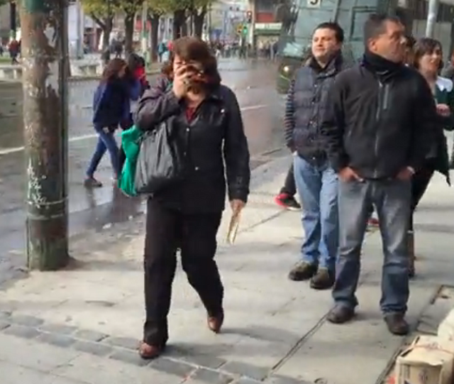 Woman with scarf over face
