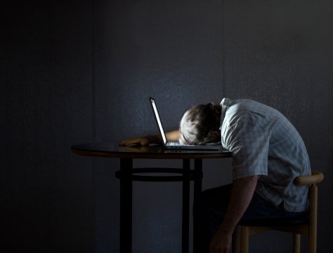 man-sleeping-while-using-the-laptop