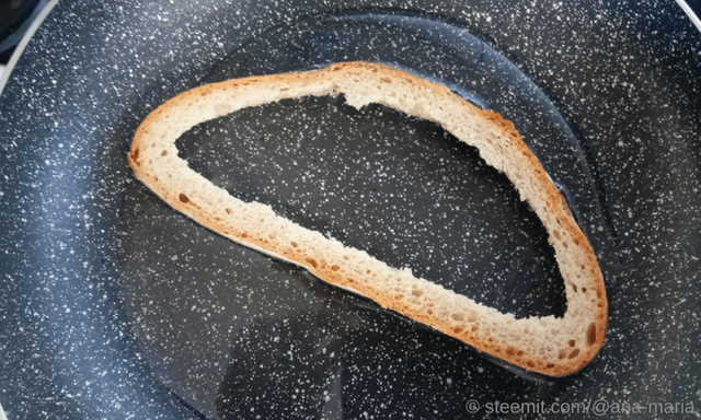 Frying Bread for the Eggs in the Bread