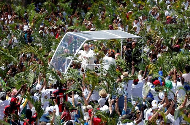Pope Francis arrives in Papamobile to celebrate a mass at the monument to Mary, Queen of Peace in Port Louis, Mauritius. REUTERS/Yara Nardi