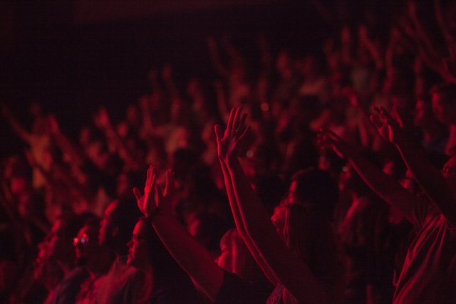 A rag-tag audience of about thirty...