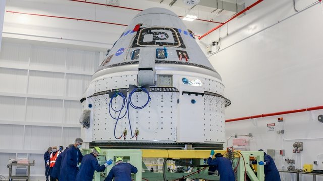 Image from https://spacenews.com/wp-content/uploads/2021/06/starliner-oft2-preps.jpg