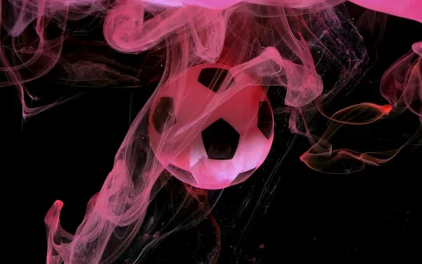 Soccer ball on amazing pink space background. Concept of adverti — Stock Photo, Image