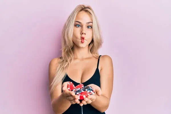 Beautiful Caucasian Blonde Girl Holding Casino Chips Making Fish Face — Stock Photo, Image