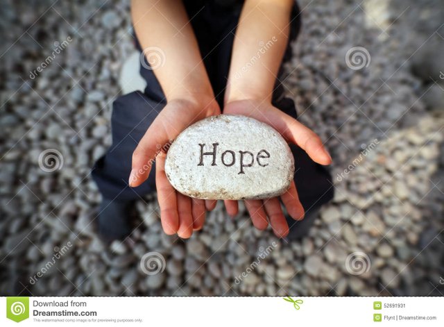 hope-child-beach-hands-cupped-holding-stone-pebble-word-engraved-concept-faith-love-spirituality-52691931.jpg